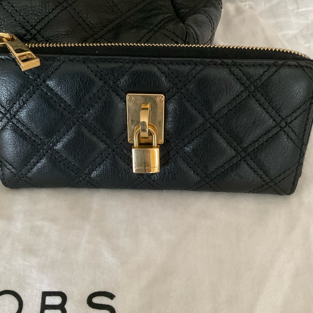 Marc Jacob’s quilted wallet with gold hardware.